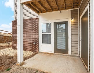 Private patio with a door to enclosed storage  at Signature Pointe Apartment Homes, Alabama, 35611