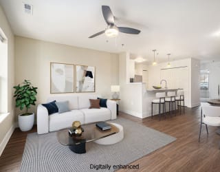 living room with ceiling fan at Signature Pointe Apartment Homes in Athens, AL