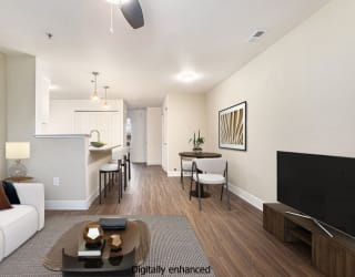 living, dining, and kitchen areas with hard surface floors at Signature Pointe Apartment Homes in Athens, AL