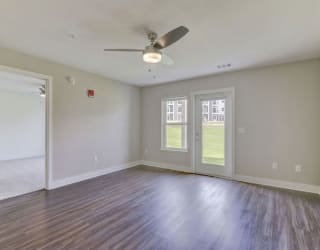 living room with a ceiling fan and wood floors  at Signature Pointe Apartment Homes, Alabama, 35611