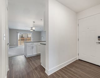 Entry to kitchen and living room with hard surface floors  at Signature Pointe Apartment Homes, Athens, AL, 35611