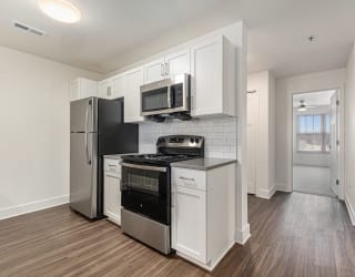 kitchen with hard surface flooring  at Signature Pointe Apartment Homes, Alabama
