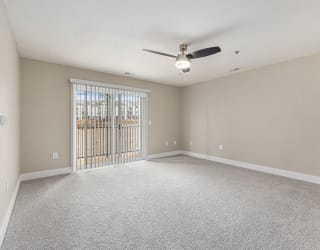 living room with a ceiling fan and a slider to a balcony  at Signature Pointe Apartment Homes, Athens, 35611