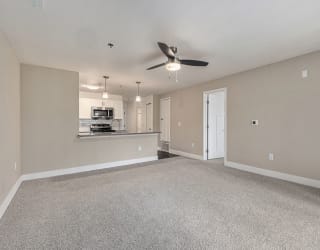 spacious living room with a ceiling fan  at Signature Pointe Apartment Homes, Athens, AL