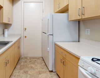 a kitchen with a sink and a refrigerator at Swiss Valley Apartments, Michigan