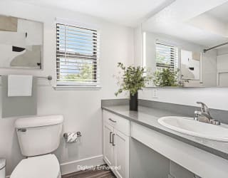 a bathroom with a window at The Crossings Apartments, Michigan, 49508