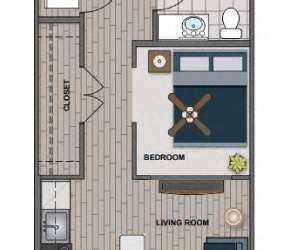 A floor plan of a small apartment with a bedroom, living room, kitchen, and bathroom.