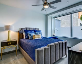 Bedroom with cozy bed at The Grand, Kansas City