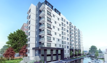 a rendering of a white and black apartment building next to a river