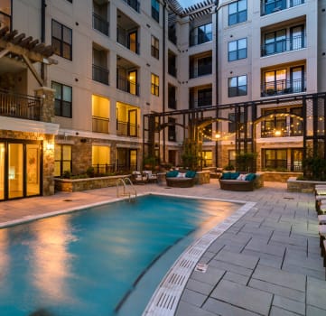 Swimming Pool with Lounge Seating with leasing office exterior at Berkshire Dilworth, Charlotte, North Carolina