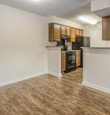 a kitchen and living room in an apartment