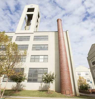 a large brick chimney on the side of a building