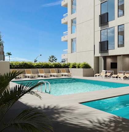 a swimming pool in front of a building