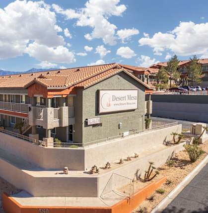 A building with a sign that says Desert Mesa.