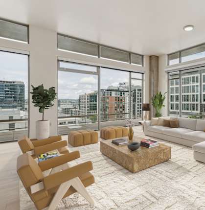 A modern living room with a large window overlooking the city.