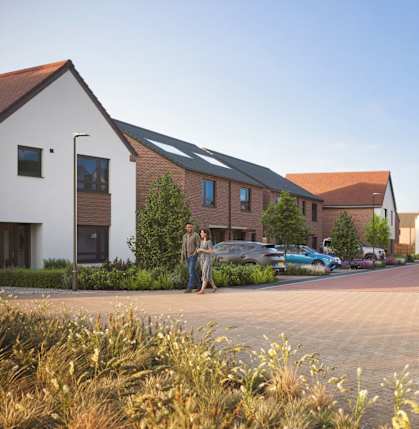 A residential area with houses and people walking.