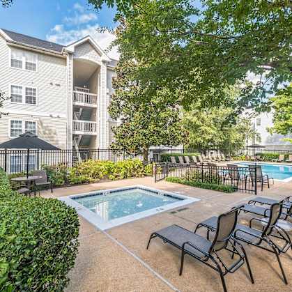 our apartments have a resort style pool and lounge chairs  at Sanger Place, Lorton, Virginia