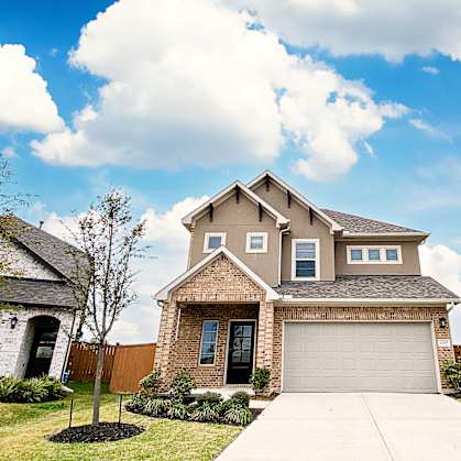 a house with a garage on a sunny day