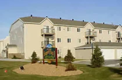 A large building with a sign in front of it.
