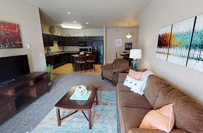living room, kitchen, furnished at Stonebridge Villas Apartments, Minot