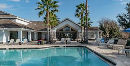 a house with a swimming pool in front of it