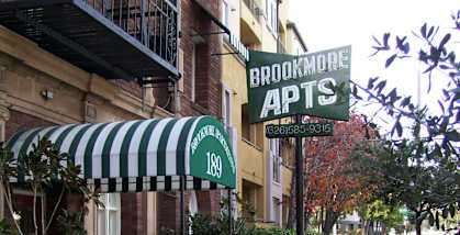 Brookmore Entrance with Vintage Awning and Neon Sign