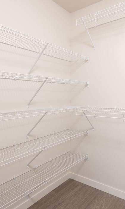 Empty white shelves in a room.
