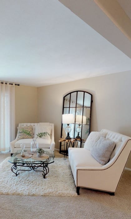 a living room with a couch and a table