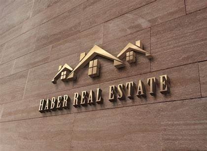 a sign on the side of a building that says harber real estate