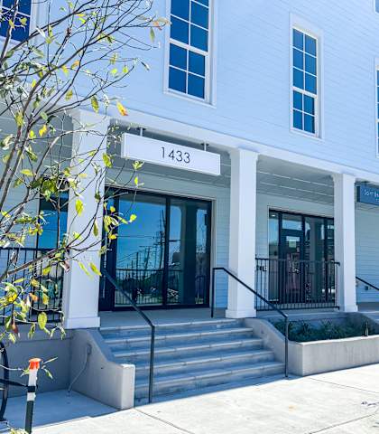 A white building with the number 1433 on the front.