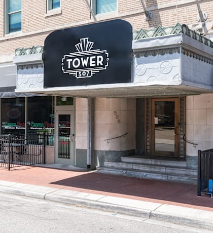 the front of a building with a tower 301 sign