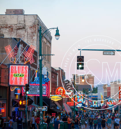 a crowd of people walking down a busy city street