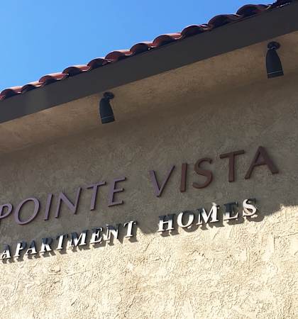 a view of the front of the point vista apartment homes building