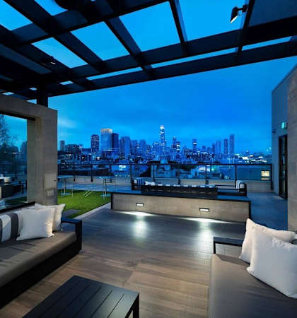 modern living room with a view of the city at night