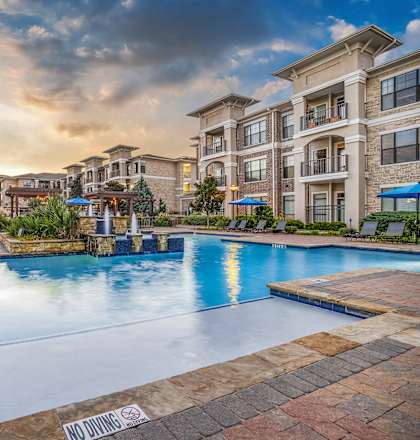 the preserve at ballantyne commons swimming pool with apartment buildings