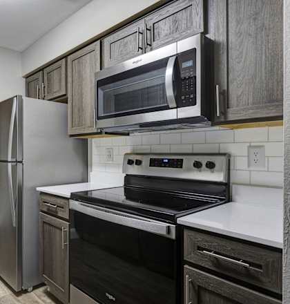 the preserve at ballantyne commons apartment kitchen with stainless steel appliances