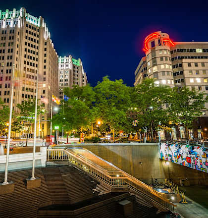 Nighttime view of the exterior buildings and city at The Metropolitan in Maryland, 20814.