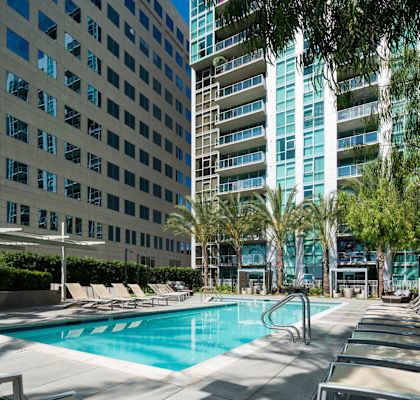a swimming pool in front of a tall building at Vue in  CA, 90731