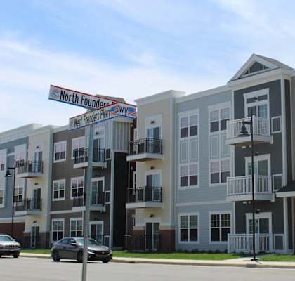a row of new apartment buildings on a city street