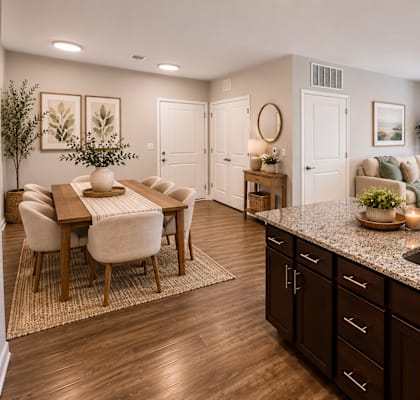 A kitchen with dark wood cabinets and a granite countertop.