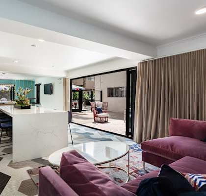 a living room with a kitchen and a dining room
