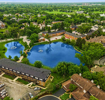 a birdseye view of a large pond in the middle of a city at The Hinsdale, Hinsdale