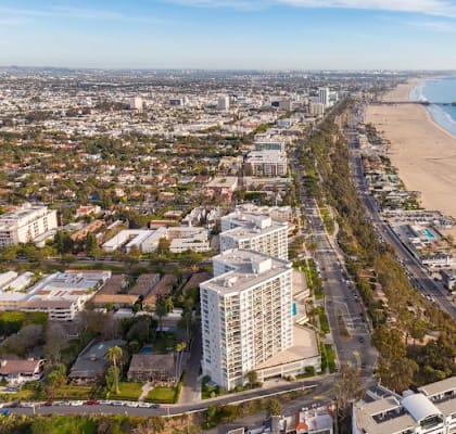 an aerial view of the beach and the city of Santa Monica