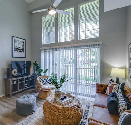 a living room with a large window and a couch