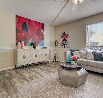 a living room with a couch and a window