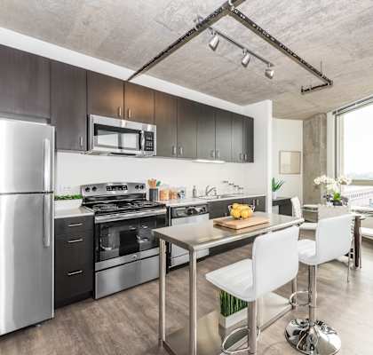 a kitchen and dining area in a 555 waverly unit at Lakeview 3200 Apartments, Chicago, IL, 60657