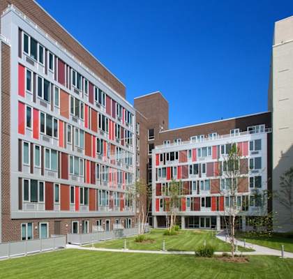 a view of the exterior of a building with a grassy courtyard at 34 Berry, Brooklyn, New York