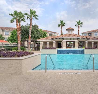 a pool with a building in the background
