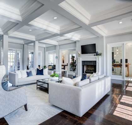 a living room with couches and chairs and a fireplace at Century Lakeshore Crossings, Alabama, 35211
