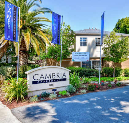 A building with a sign that says "CAMBRIA" in front of it.